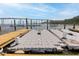 View from a dock with floating docks towards a river, bridge, and gazebo at 108 Fairbanks Oak Aly # 201, Charleston, SC 29492