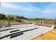 Wide view of a dock and a modern dock with a bridge and modern buildings in the distance at 108 Fairbanks Oak Aly # 201, Charleston, SC 29492