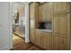 Elegant kitchen showcasing custom wood cabinets and stainless steel refrigerator at 108 Fairbanks Oak Aly # 201, Charleston, SC 29492