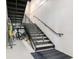 View of basement stairs with metal railings, and bikes at 108 Fairbanks Oak Aly # 201, Charleston, SC 29492