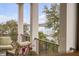 Balcony view of pier and harbor featuring comfortable seating and wrought iron railing at 108 Fairbanks Oak Aly # 302, Daniel Island, SC 29492