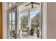 Charming covered balcony with comfortable seating and a ceiling fan, perfect for enjoying the outdoors at 108 Fairbanks Oak Aly # 302, Daniel Island, SC 29492