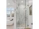 Modern bathroom featuring a glass-enclosed shower with marble tile and a freestanding soaking tub at 108 Fairbanks Oak Aly # 302, Daniel Island, SC 29492