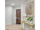 Entryway featuring a wooden door, art, a side table and views of the interior at 108 Fairbanks Oak Aly # 302, Daniel Island, SC 29492