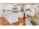 Modern kitchen featuring white cabinets, marble countertops, wine cooler, and stainless steel appliances at 108 Fairbanks Oak Aly # 302, Daniel Island, SC 29492
