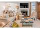 Inviting living room featuring a fireplace, comfortable seating, and an open view to the dining area at 108 Fairbanks Oak Aly # 302, Daniel Island, SC 29492