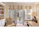 Inviting office space with built-in bookshelves and large windows to outdoor seating at 108 Fairbanks Oak Aly # 302, Daniel Island, SC 29492