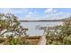 View of a pier on the waterway. Cloud formations in the blue sky above at 108 Fairbanks Oak Aly # 302, Daniel Island, SC 29492