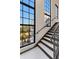 Bright stairwell with large windows offering natural light and outdoor views at 108 Fairbanks Oak Aly # 302, Daniel Island, SC 29492