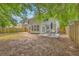 The house backyard features a table and chairs set perfect for relaxing and outdoor dining at 110 Moon Shadow Ln, Summerville, SC 29485