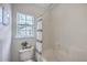 Bathroom featuring a bathtub with a shower and white decorative accents at 110 Moon Shadow Ln, Summerville, SC 29485