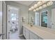 Bathroom with gray walls, double vanity, and view into the bedroom at 110 Moon Shadow Ln, Summerville, SC 29485