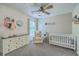 Bedroom with white crib, changing table, and neutral décor at 110 Moon Shadow Ln, Summerville, SC 29485