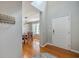 Inviting entryway with gleaming hardwood floors, welcome decoration, and dining room view at 110 Moon Shadow Ln, Summerville, SC 29485