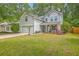 Beautiful two-story home with a well-maintained lawn, light gray siding, and an inviting front porch at 110 Moon Shadow Ln, Summerville, SC 29485