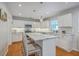 Spacious kitchen with a large island, subway tile backsplash, and white cabinets at 110 Moon Shadow Ln, Summerville, SC 29485