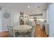 Kitchen boasts stainless appliances, center island, and a breakfast table at 110 Moon Shadow Ln, Summerville, SC 29485