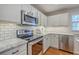 Modern kitchen featuring stainless steel appliances, white cabinets and marble countertops at 110 Moon Shadow Ln, Summerville, SC 29485