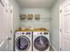 Well-equipped laundry room with side-by-side washer and dryer at 110 Moon Shadow Ln, Summerville, SC 29485