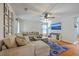 Cozy living room featuring a comfortable sectional sofa, entertainment center, and hardwood floors at 110 Moon Shadow Ln, Summerville, SC 29485
