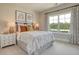 Cozy bedroom with bright natural light, stylish decor, and neutral tones for a relaxing and comfortable space at 114 Headwater Dr, Summerville, SC 29486
