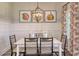 Cozy dining room with unique light fixture and decorative artwork at 114 Headwater Dr, Summerville, SC 29486
