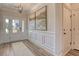 Bright entryway featuring wainscoting, wood floors, and a front door with glass panels allowing natural light at 114 Headwater Dr, Summerville, SC 29486