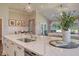 Large kitchen island with white countertops and stainless steel appliances, flowing into living space at 114 Headwater Dr, Summerville, SC 29486