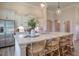 Spacious kitchen island featuring white countertops, stainless steel appliances, and seating at 114 Headwater Dr, Summerville, SC 29486