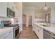 Well-appointed kitchen with stainless steel appliances and a view to a dining space at 114 Headwater Dr, Summerville, SC 29486