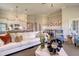 Bright, open-concept living room with modern décor and access to the kitchen and dining area at 114 Headwater Dr, Summerville, SC 29486