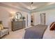 Relaxing bedroom featuring neutral tones, a large dresser, and a view of the ensuite bathroom and walk-in closet at 114 Headwater Dr, Summerville, SC 29486