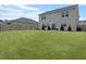 Spacious backyard featuring a well-maintained lawn, ideal for recreation and outdoor activities at 115 Daniels Creek Cir, Goose Creek, SC 29445