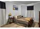 Well lit bedroom with plank flooring, a double window and full furnishings at 115 Daniels Creek Cir, Goose Creek, SC 29445