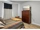 Comfortable bedroom featuring a wood dresser with a TV, and plank flooring at 115 Daniels Creek Cir, Goose Creek, SC 29445