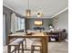 Dining area includes an entertainment center and view into the living room at 115 Daniels Creek Cir, Goose Creek, SC 29445