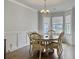Inviting dining room with a round table, chandelier, and plenty of natural light at 115 Daniels Creek Cir, Goose Creek, SC 29445