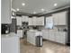 Modern kitchen with white cabinets, stainless steel appliances, and a functional island at 115 Daniels Creek Cir, Goose Creek, SC 29445