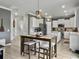 Kitchen and dining area feature an island and stainless steel appliances at 115 Daniels Creek Cir, Goose Creek, SC 29445
