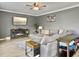 Cozy living room with fireplace and large sectional sofa at 115 Daniels Creek Cir, Goose Creek, SC 29445