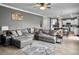 Comfortable living room with a large sectional sofa and open access to the kitchen at 115 Daniels Creek Cir, Goose Creek, SC 29445