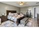 Spacious main bedroom with large bed, area rug, ceiling fan, and decor at 115 Daniels Creek Cir, Goose Creek, SC 29445