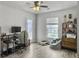 Sunlit office space with large window, ceiling fan, desk, and decor at 115 Daniels Creek Cir, Goose Creek, SC 29445