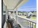 Relaxing front porch view with chairs and neighborhood views at 115 Daniels Creek Cir, Goose Creek, SC 29445
