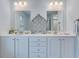 Bathroom features a double vanity with modern fixtures, large mirrors, and ample cabinet space at 120 Loon Dr, Summerville, SC 29483