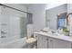 Clean bathroom with a combined tub and shower, white vanity, and soft decor at 120 Loon Dr, Summerville, SC 29483