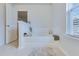 Relaxing soaking tub with tile surround and natural light from the nearby window at 120 Loon Dr, Summerville, SC 29483