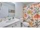 Charming bathroom with unique shower curtain and framed art at 120 Loon Dr, Summerville, SC 29483