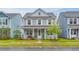 Charming two-story home with a welcoming front porch and manicured lawn at 120 Loon Dr, Summerville, SC 29483