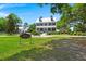 Elegant two-story home with a charming bench out front and well manicured lawn at 120 Loon Dr, Summerville, SC 29483